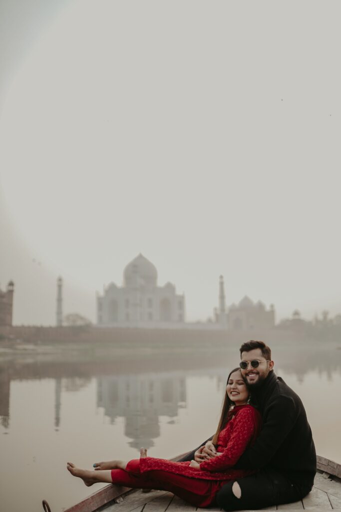 Photo by DARKMODE CINEMA: https://www.pexels.com/photo/young-couple-sitting-in-a-boat-on-a-river-near-taj-mahal-18357547/